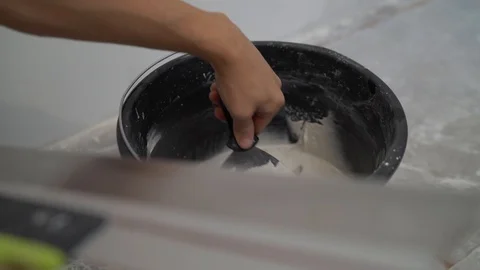 Master applies putty with a spatula. Stock Footage 118775279