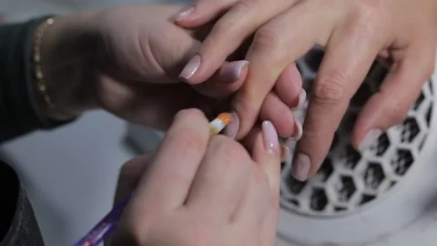 Master apply varnish on nails, close-up Stock Footage 224446206