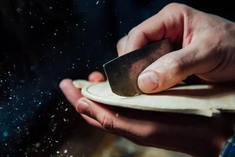 Master artisan luthier working on the creation of a violin. painstaking detailed Stock Photos