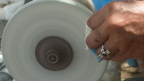 Master Artisan Polishing Organic Shell Piece with Grinding Tool Video stock 337636897
