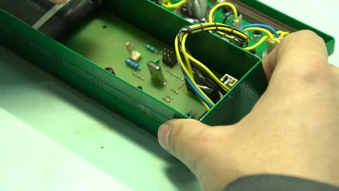 The master assembles the junction box Stock Footage 157758645