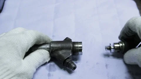The master assembles the parts into a mechanism Stock Footage 145660845