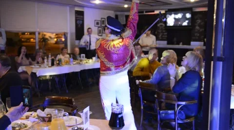 Master of banquets Eugene Prihodko is imitating Freddie Mercury Stock Footage 63450055