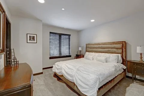 Master bedroom interior with queen size bed and vintage furniture. Northwest, Stock Photos