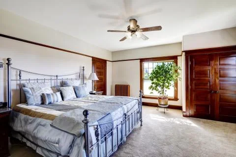 Master bedroom with iron frame bed Stock Photos
