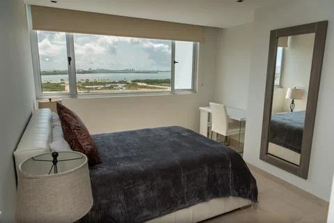 Master bedroom with workspace and panoramic view Stock Photos