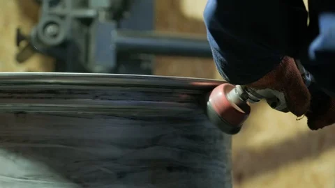 Master body repair man is working on preparing the surface of the aluminum wheel Stock Footage 119519191