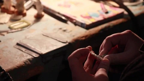 Master bone carving hones the shape of bones Stock Footage 83516690