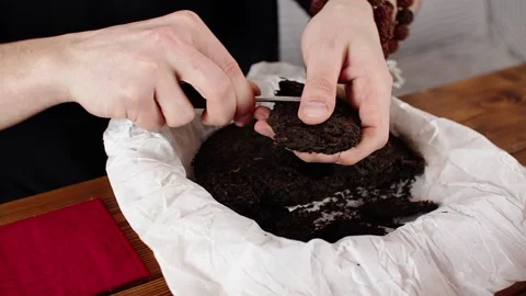 The master breaks the tea with a special awl Stock Footage 139332048