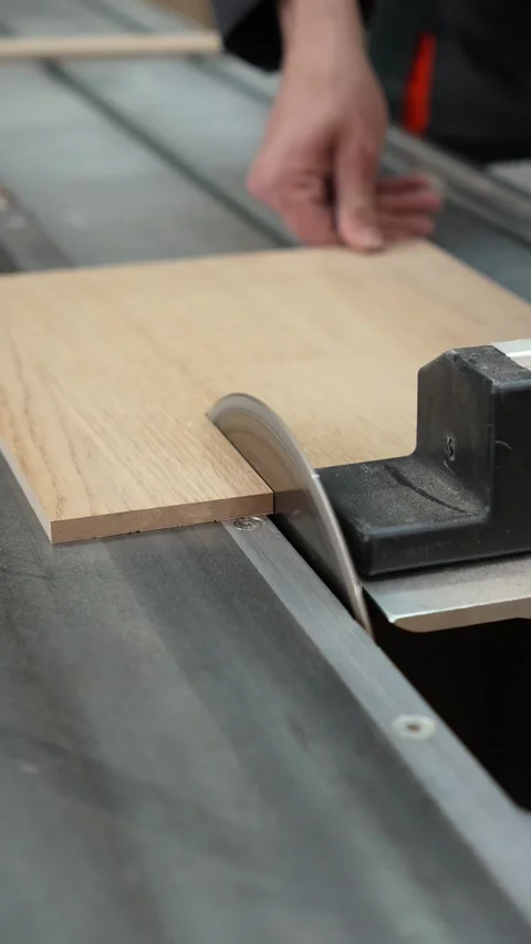 Master builder cuts a wooden panel on a format cutting machine Video stock 317414673