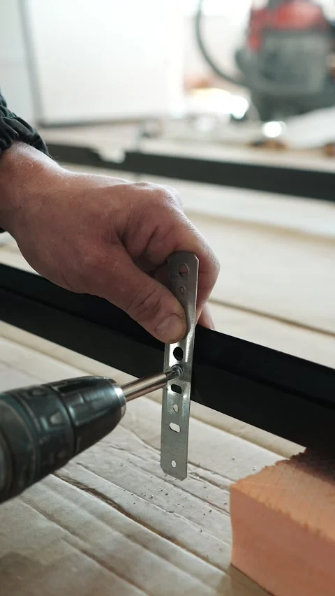 Master builder makes installation of doors and repairs inside house Stock Footage 302984786