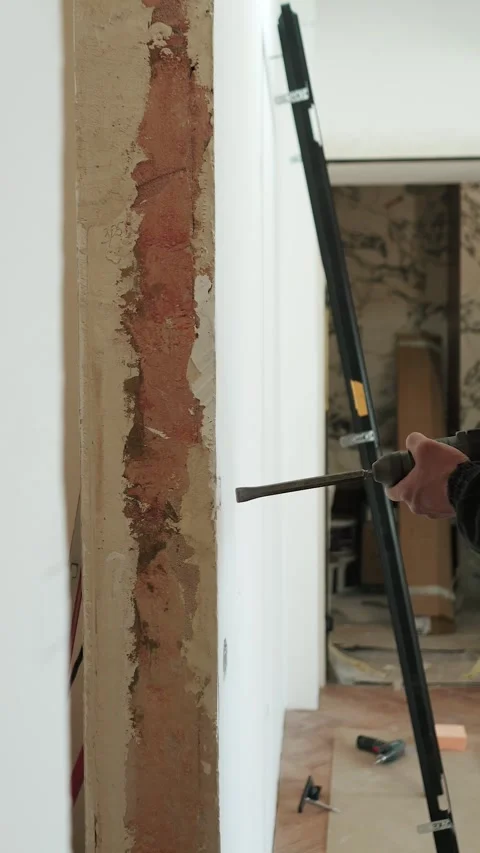 Master builder makes installation of doors and repairs inside house Stock Footage 302984823