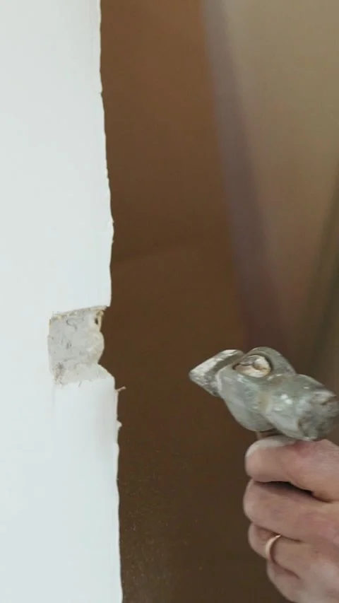 Master builder makes installation of doors and repairs inside house Stock Footage 302984914