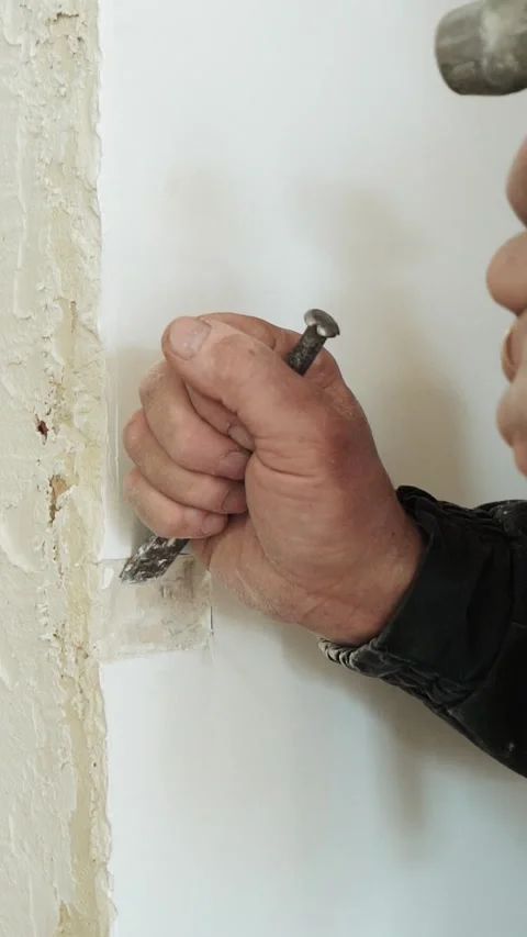 Master builder makes installation of doors and repairs inside house Stock Footage 302986269