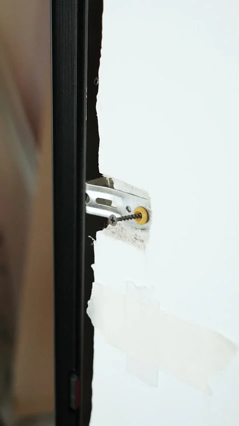 Master builder makes installation of doors and repairs inside house Stock Footage 302986388