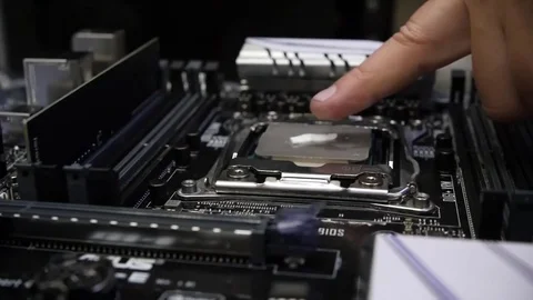 The master can finger a thermal paste on the processor. HD, 1920x1080. slow Stock Footage 81630869