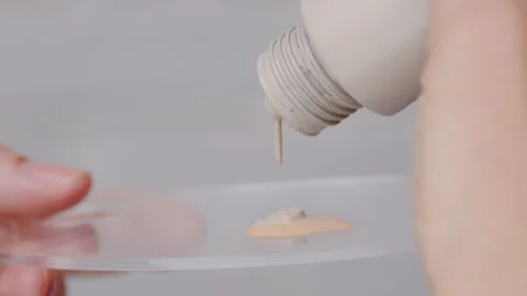Master the careful application of foundation for a flawless, longlasting makeup Stock Footage 302834468
