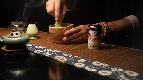 Master carefully stirs the tea mixture Stock Footage 107822663