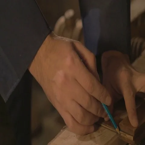 Master carpenter makes basting on the Board with a pencil, draws, craftsman work Stock Footage 69725469