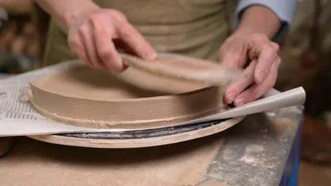 Master ceramist works in pottery studio. Process of creating plate Stock Footage 170603756