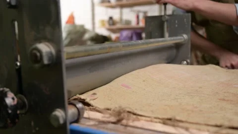 Master ceramist works in pottery studio. Process of creating plate Stockbeeldmateriaal 170603856