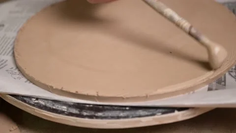 Master ceramist works in pottery studio. Process of creating plate Stock Footage 170603896