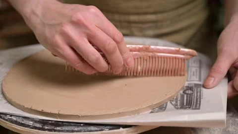 Master ceramist works in pottery studio. Process of creating plate Stock Footage 170604315