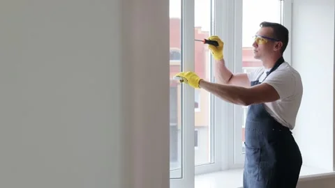 Master changes the setup from summer mode to winter mode on the pvc window Stock Footage 132692963