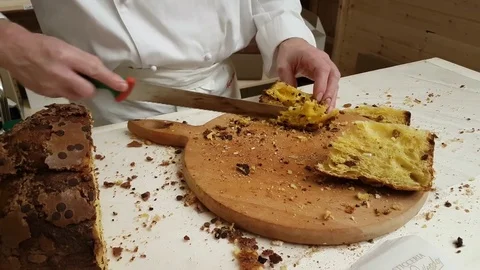 Master Chef cuts and serves a slice of Christmas panettone Stock Footage 82712130