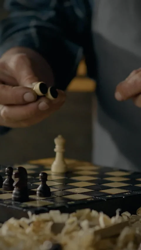 A master chessman and board maker checks the products for quality and size s Stock Footage 331528895