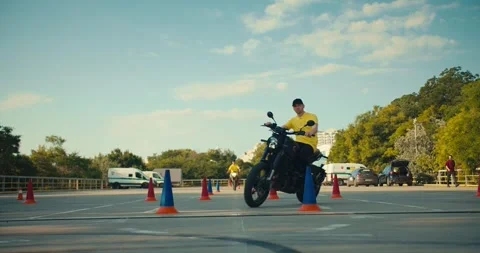 Master class from 2 motorcycle driving experts. Two expert guys skillfully go Stock Footage 249310489