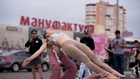 Master class in acroyoga in the city center Stock Footage 170065219