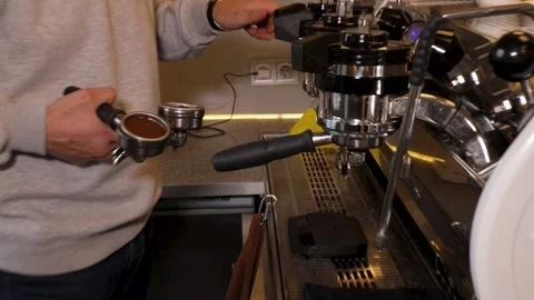 Master class barista. Freshly ground coffee for the coffee machine. Stock Footage 231143951