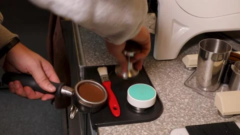 Master class barista. Freshly ground coffee for the coffee machine. Stock Footage 231143952