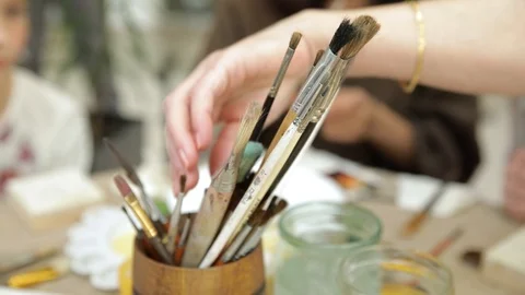 Master class for drawing icons in shopping center brushes close up Stock Footage 103853445