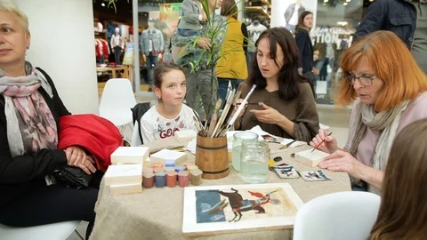 Master class for drawing icons in shopping center victoria gardens lviv 25.08 Stock Footage 103853517