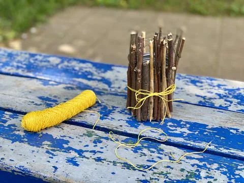 Master class, how to make a vase from sticks and tin cans, kids craft Stock Photos
