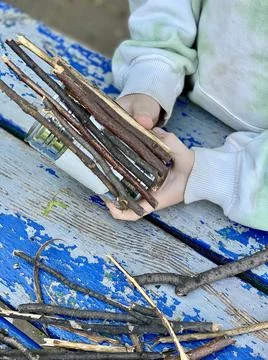 Master class, how to make a vase from sticks and tin cans, kids craft Stock Photos