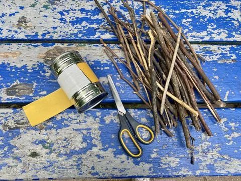 Master class, how to make a vase from sticks and tin cans, kids craft Stock Photos