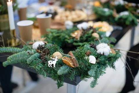 Master class on making and decorating Christmas wreaths from live spruce. The Stock Photos