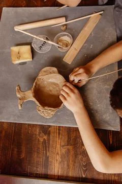 Master class on modeling a bucket of clay Stock Photos