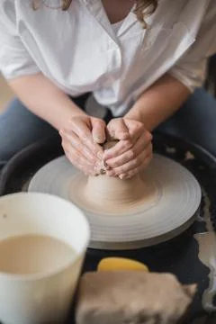 Master class on modeling of clay on a potter wheel In the pottery workshop Stock Photos