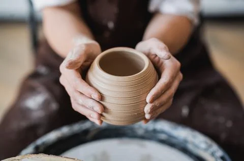 Master class on modeling of clay on a potter wheel In the pottery workshop Stock Photos