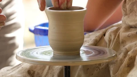 Master class on modeling of clay on a potter's wheel In the pottery workshop Stock Footage 114583315