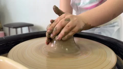 Master class on modeling of clay on a potters wheel In the pottery workshop Stock Footage 307183564