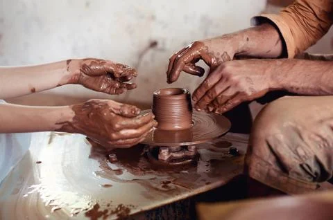 Master class on modeling of clay on a potter's wheel In the pottery workshop Stock Photos