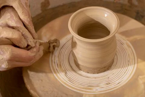 Master class on modeling of clay on a potter's wheel In the pottery workshop Stock Photos