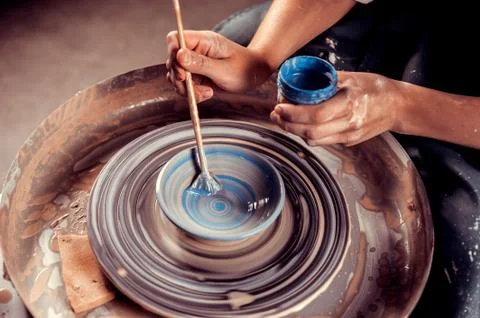 Master class on modeling of clay on a potter's wheel In the pottery workshop Stock Photos