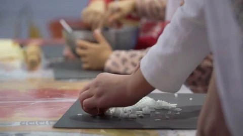 Master class teaching group children cooking cakes with their parents, child Stock Footage 83325425