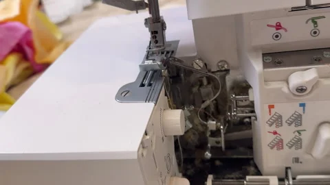 Master clean the overlock sewing machine from dust Stock Footage 306278145